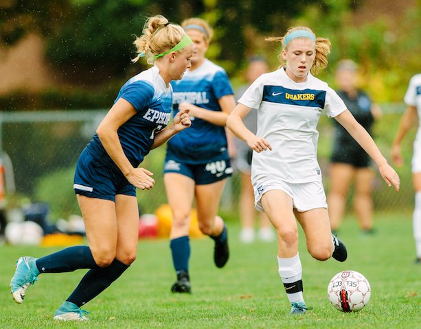 US girl kicking ball on PC/GA day